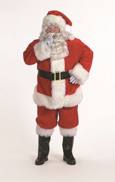 a man dressed as santa clause standing with his hands on his hips