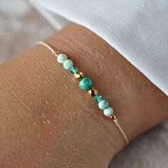 ✦ Gemstone Bracelet with malachite, Swarovski, 24k Gold Filled, Delicate adjustable bracelet, Minimalist Bracelet, Everyday Bracelet ✦ This bracelet made of beige jewelry string and natural stones with a size of 2mm to 4mm. ✔ 100% natural malachite (not synthetic) ✔ Peruvian turquoise ✔ Swarovski bicone crystals ✔ Czech beads covered with 24k gold ✦ The bracelet is adjustable thanks to the macrame weaving technique, it is comfortable to put on.  The nylon string makes the bracelet very durable ✦ Your bracelet will be packed in a hand made envelope with a brand logo, making it perfect for gifting  ✦ If you want to give jewelry to a loved one and leave a message for them, give me its content in the message when buying  ✦ Perfect bracelet: ✦ * for myself :) * as a gift for mom/sister/friend * Gold Gemstone Beads Friendship Bracelets For Gift, Gold Friendship Bracelets With Gemstone Beads As A Gift, Gold Friendship Bracelets With Gemstone Beads, Gold Friendship Bracelets With Natural Stones As Gift, Adjustable Minimalist Beaded Bracelets For May Birthstone, Elegant Adjustable Green Friendship Bracelets, Handmade Adjustable Beaded Bracelets For May Birthstone, Minimalist Green Bracelet With Sliding Knot, Natural Stone Jewelry Diy