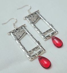 Guillotine earrings with red bead blood drop.  Earring hooks are 925 sterling silver,  so great for sensitive ears and allergies!  you can find my other listings here: https://grumpyqueer.etsy.com Guillotine Earrings, Weird Earrings, Blood Drop, Earrings Halloween, Gothic Punk, Halloween Earrings, Earring Hooks, Red Bead, Drop Earring