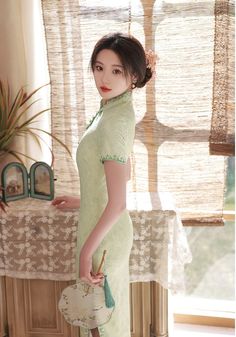 Elegant Fitted Ao Dai For Tea Ceremony, Fitted Dress For Tea Ceremony, Elegant Floral Embroidered Dress With Stand Collar, Traditional Fitted Dress For Tea Ceremony, Traditional Fitted Dress With Stand Collar, Fitted Ao Dai With Floral Embroidery And Stand Collar, Green Cheongsam For Wedding, Traditional White Cheongsam For Summer, Elegant Fitted Cheongsam With Floral Embroidery