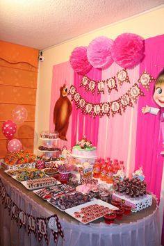 the table is full of candy and desserts for children's birthday party or baby shower