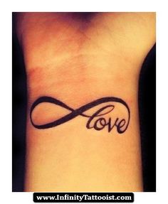 a wrist tattoo with the word love written in cursive font and an infinite knot