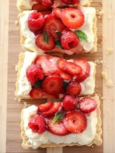 strawberry shortbreads with whipped cream and fresh strawberries on top are ready to be eaten