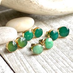 Gorgeous raw chrysoprase stud earrings electroplated in 24k gold.★Metal- 24k Gold Over Brass★Stone-Untreated Polished Natural Chrysoprase★Dimensions- Approx. 5mm-8mm★We want you to love your new jewelry and gladly accept returns.★Arrives ready for gifting (example in last photo) and usually ships same day or next day. Check shop announcement for occasional delays.Known for manifesting optimism, joy, and happiness, the Chrysoprase crystal stone is one of the best antidepressants in the world of c Green Stone Earrings, Chrysoprase Jewelry, Raw Stone Earring, Stone Stud Earrings, Earrings Stone, Turquoise Stud Earrings, Gem Earrings, Jade Earrings, Green Gems