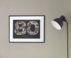 a black lamp next to a framed photo with the number 80 on it's side