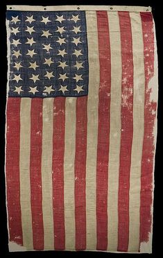 an old american flag with white stars on the bottom and red, white, and blue stripes