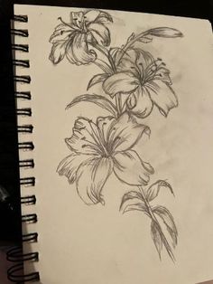 a pencil drawing of flowers on a piece of paper