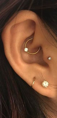 a woman with ear piercings on her ears