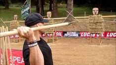 a man holding a baseball bat over his shoulder