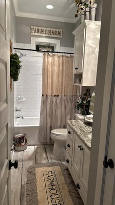 a bathroom with a rug on the floor