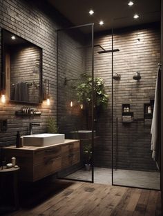 a bathroom with brick walls and wooden flooring is lit by recessed lights, along with a walk - in shower