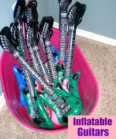 there is a pink bowl with guitars in it