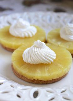 three pineapple slices with whipped cream on top