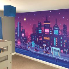 a child's bedroom with a wall mural depicting a city at night