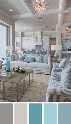 a living room filled with lots of furniture and blue accents in shades of gray, beige, and white