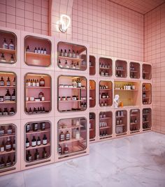 a room with shelves filled with bottles and containers on the wall, all lined up against each other