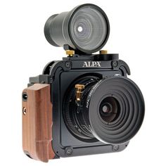 an old fashioned camera with wooden tripod