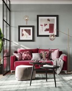 a living room filled with furniture and pictures on the wall above it's coffee table