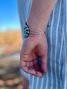 Accentuate your wrist with this luxurious Tala Navajo Turquoise Sterling Silver Cuff Bracelet. Aptly constructed with genuine sterling silver and adorned with authentic Turquoise stones, this Indian Handcrafted bracelet is a subtle testament to exquisite craftsmanship. An opulent yet timeless piece of jewelry that will surely be an eye-catching addition to any outfit. Suggested Retail: Southwestern Style Sterling Silver Bracelet, Bracelet Indian, Navajo Turquoise, Handcrafted Bracelets, Sterling Silver Cuff Bracelet, Turquoise Stones, Genuine Turquoise, Sterling Silver Cuff, Silver Cuff Bracelet