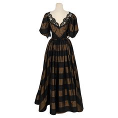 Louis Feraud - (Made in France) Haute Couture black and brown silk taffeta dress sewn with lace. No size nor composition label, it fits a 36FR/38FR. Additional information: Condition: Very good condition Dimensions: Chest: 40 cm - Waist: 31 cm - Length: 150 cm Seller Reference: VR262 Vintage Schiaparelli Dress, Brown Haute Couture, Schiaparelli Dress 1930s, Louis Feraud 60s, Schiaparelli Lion Dress, Louis Feraud, Taffeta Dress, Brown Silk, Silk Taffeta