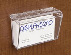 a clear display case on a wooden surface with the name display 250 printed on it