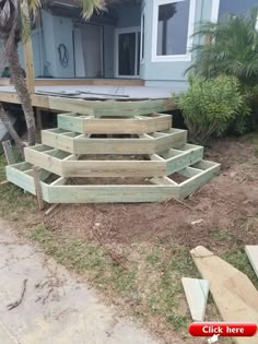 some wooden steps sitting in front of a house