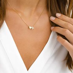 "PERSONALIZED INITIAL HEART NECKLACE Treat yourself or a friend! Our Personalized Initial Heart Necklace offers elegant style details while adding the minimalist touch of meaning to your everyday look. This dainty piece features an initial perfectly accented with a heart. ITEM SPECIFICATIONS * Finish: 925 Sterling Silver ∙ 18K Gold ∙ Rose Gold * Dimensions: Length 17\"	in stock	35.00 USD	17.50 USD	0.00 USD	Weddings > Jewelry > Necklaces
https://i.etsystatic.com/39711490/r/il/234023/4923593704/il Rose Gold Initial Necklace, Initial Heart Necklace, Tiny Heart Necklace, Personalized Gold Necklace, Initial Necklace Silver, Initial Necklace Gold, Tiny Heart, Personalized Initials, Initial Letter