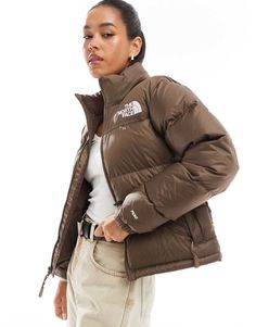 Coats & Jackets by The North Face Your go-to for cooler climes Packable hood can be stowed inside collar High collar Zip fastening Logo embroidery to front and back Functional pockets Elastic cuffs Regular fit The North Face Puffer Jacket With Padded Collar, The North Face Brown Puffer, The North Face Puffer Jacket Brown, Dark Oak North Face Puffer, Brown Winter Jacket, Brown North Face Puffer, The North Face 1996 Retro Nuptse Brown, Brown North Face, Women Puffer Jacket