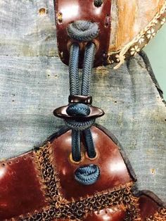 a close up of a brown leather belt