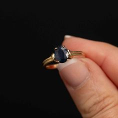 Adorn yourself with understated elegance wearing this 14K gold oval blue sapphire ring. The minimalist design places emphasis on the natural beauty of the 6mm x 8mm oval sapphire, creating a timeless piece that seamlessly complements any style. The oval sapphire takes center stage, delicately cradled in a secure prong setting. A subtle gold accent gracefully wraps around the top of the shoulder closest to the stone, adding a touch of sophistication without overshadowing the gem's radiance. Enhan Oval Sapphire Ring, Saphir Ring, Blue Sapphire Ring, Blue Sapphire Rings, Onyx Ring, Gold Accent, Understated Elegance, Center Stage, Gold Style