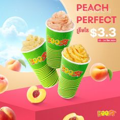 two green cups filled with peaches next to each other on top of a pink surface