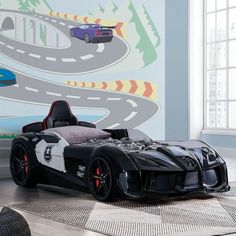 a child's bedroom with a race car bed