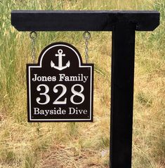 a black and white sign that says jones family 324 bayside drive with an anchor on it