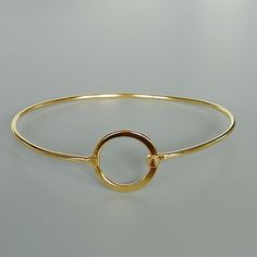 A set of sterling silver and gold plated circle of life cuff bangles. This listing is for TWO PIECES of bangles Length: 7 cms circle: 16 mm This bangle is made of 925 hypoallergenic sterling silver, one is silver and one is plated in gold. This piece is sent in a gift box. I can include a personal message from you if needed You are welcome to contact me at... bhavnakwintra1956@gmail.com For more beautiful pieces from my shop, please browse 👇 TOE RINGS: https://www.etsy.com/your/shops/TheSilverG Everyday Metal Bangle, Adjustable Modern Bangle, Modern Adjustable Round Bangle, Simple Bangle Bracelets As Gifts, Metal Circle Bracelets As Gift, Simple Bangle Bracelet As Gift, Metal Bracelets As Gift, Metal Bracelets Gift, Simple Design Bangle Bracelet For Gift