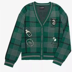 a green cardigan sweater with patches on it