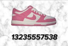 a pair of pink and white shoes with the words 1235 537388