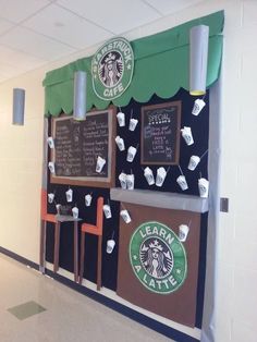 a starbucks coffee shop with chalkboard menus on the wall