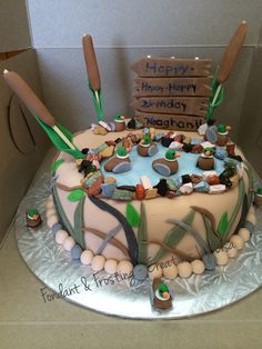 a birthday cake decorated with rocks and leaves