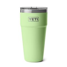 a green yeti cup with the word yeti on it is shown in front of a white background