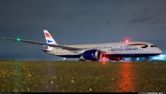 an airplane on the runway at night time