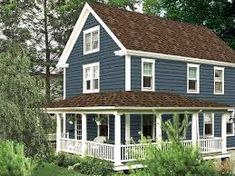 a blue house in the woods with trees and bushes around it's front porch