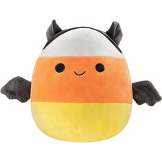 an orange and white stuffed animal with black ears