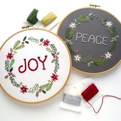 two embroidery hoops with the words joy and peace on them next to each other