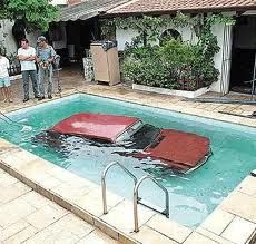 people standing around an empty swimming pool