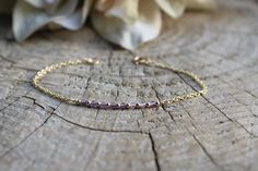 Beautiful crystals are combined with a dainty chain to create this beautiful bracelet.  Amethyst has been renowned for its beauty throughout the ages and is also the birthstone for anyone born in the month of February. D E T A I L S  *It features micro- faceted Brazilian amethyst gemstones - separated by seamless gold filled beads. *Beads measure around 2mm and originate from  *Choose between and 18k gold filled chain, rose gold filled or 925 sterling silver chain. *Gold filled is a wonderful al Elegant Purple Birthstone Beaded Bracelets, Dainty Amethyst Jewelry With Adjustable Chain, Dainty Amethyst Jewelry With Delicate Chain, Dainty Handmade Amethyst Bracelets, Dainty Gold Amethyst Bracelets, Elegant Purple Chain Bracelet As Gift, Dainty Amethyst Bracelets For Gift, Dainty Faceted Amethyst Jewelry, Dainty Faceted Purple Jewelry