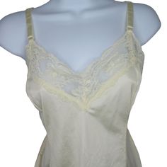 Vintage 60s Camisole M Lace Trim Nylon USA MadeBrand: Faded TagMade in USA100% NylonAll Around LaceTag Size: 16/38 = Measures SmallChest: 16" across/UnderarmsLength: 14" downside seamPre-OwnedNo defects noteditem#000/060922Features:• CamiSize: Womens MCondition: Pre-Owned Good Vintage Fitted Sleeveless Camisole, Vintage Lace Trim Tank Top, Vintage Lace Trim Camisole Tank Top, Fitted Vintage Camisole, Cream Fitted Camisole For Daywear, Fitted Cream Camisole For Daywear, Fitted Vintage Camisole For Spring, Fitted Cream Tank Top With Lace Trim, Sheer Sleeveless Beige Top