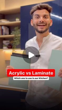 a man holding up two pieces of paper with the words acrylic vs laminate which one to use in our kitchen?