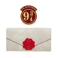 a white envelope with a red wax stamp on it and a logo for platform 94