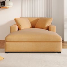 a tan couch sitting on top of a white carpeted floor next to a window