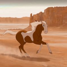 a horse running in the desert with mountains in the background